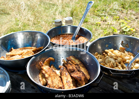 Shore lunch of baked beans deep fried walleye fillets fried potatoes with onions Stock Photo