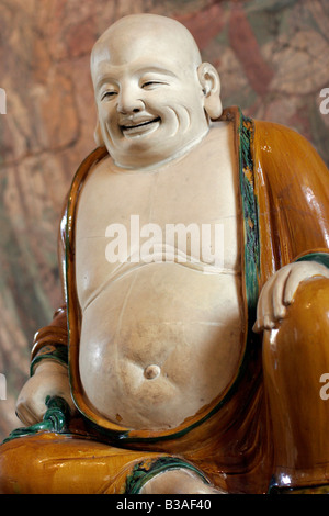 Ming Dynasty stoneware figure of a Budai in The British Museum in London Stock Photo