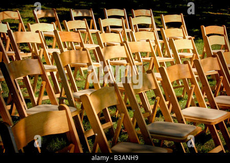 empty chairs at celebration in field Stock Photo