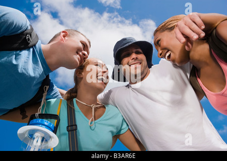 Multi-ethnic friends in huddle Stock Photo