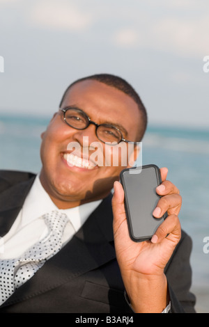 African businessman holding electronic organizer Stock Photo