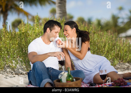Hispanic couple having picnic Stock Photo