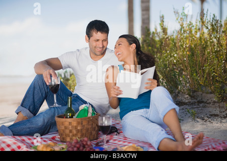 Hispanic couple having picnic Stock Photo