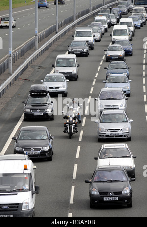 MOTORCYCLISTS FILTERING THROUGH SLOW TRAFFIC ON THE M6 MOTORWAY NEAR JUNCTION 11,STAFFORDSHIRE,UK. Stock Photo