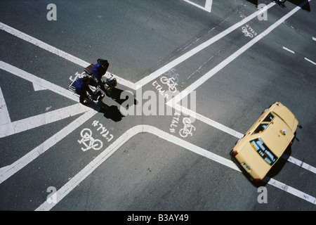 Tokyo Japan Cyclists using cycle lanes Shinjuku Stock Photo