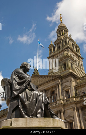 Statue of Doctor Thomas Graham 1805 1869 George Square Glasgow with city chambers in the background Stock Photo