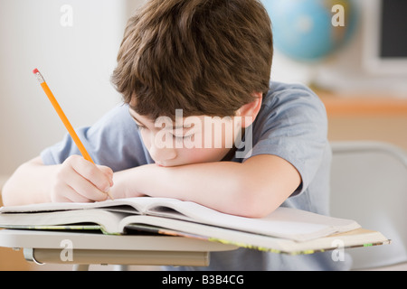 Hispanic boy doing homework Stock Photo