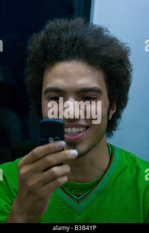 Young Iranian Man Using a Digial Camera Mobile Phone in Tehran Iran Stock Photo