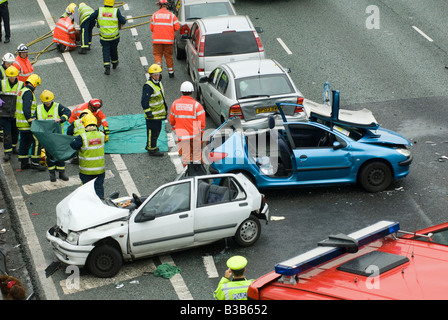 Emergency services attending a nasty road traffic accident on the m1 motorway in the midlands uk Stock Photo