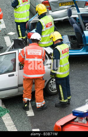 emergency services attending a nasty road traffic accident on a motorway in the uk Stock Photo