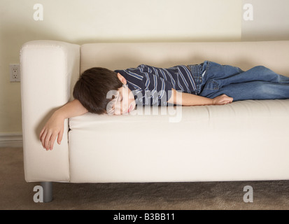 Boy Napping on Sofa Stock Photo