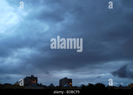 Heavy clouds over house of flats in Warsaw, Poland Stock Photo