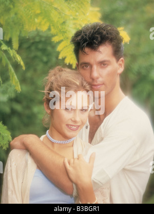 Close-up of young couple holding each other outdoors. Stock Photo