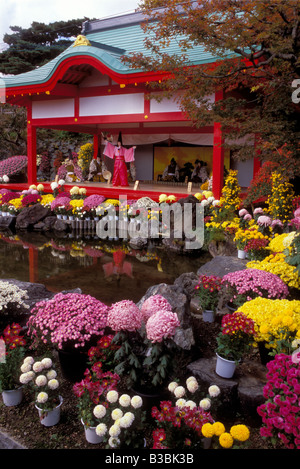 Thousands of chrysanthemum flowers adorn traditional mannequins in an historic theme at the annual Kiku Matsuri in Fukushima Stock Photo