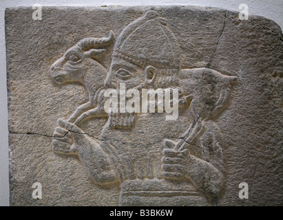 Hittites relief with a soldier carrying a ram from Samal in the Pergamon Museum in Berlin, Germany Stock Photo