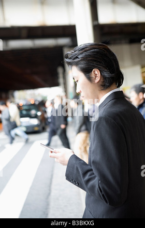 Businessman using mobile phone Stock Photo