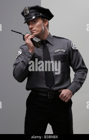 Security Guard using Walkie Talkie Stock Photo