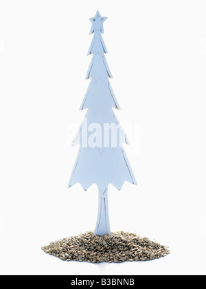 Wooden Christmas Tree Standing in Pile of Golden Rocks Stock Photo
