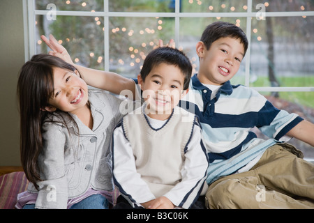 Mixed Race siblings acting silly Stock Photo