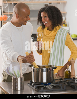 African couple making pasta Stock Photo