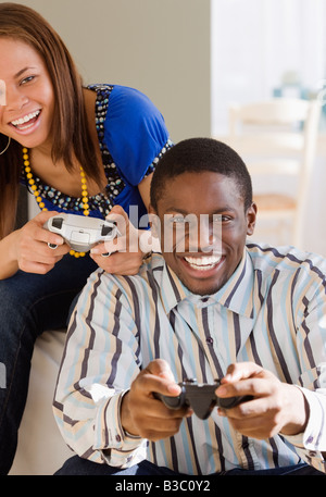 African couple playing video games Stock Photo