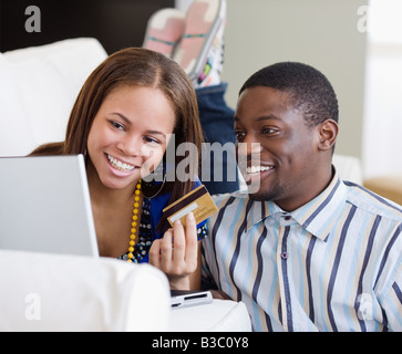 African couple shopping online