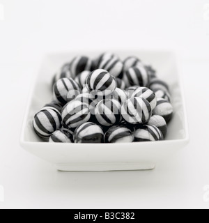 Humbug sweets in a bowl Stock Photo