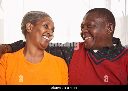 Senior couple sitting on sofa Stock Photo