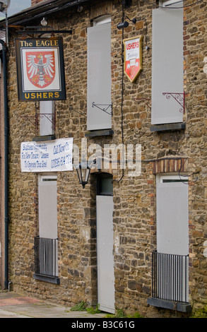 Eagle Inn public house closed and shuttered waiting for a new tenant Crosskeys Gwent South Wales Stock Photo