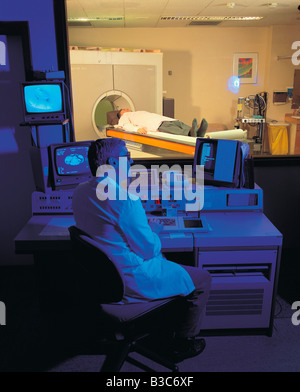 Hospital Surgeon viewing patient undergoing CAT scan. Cromwell Hospital. Kensington London. England. Stock Photo