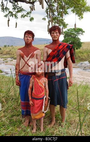 Kenya, Masai Mara National Reserve. Children on safari dressed up as Maasai moran. Stock Photo