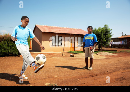 african boys playing soccer Stock Photo