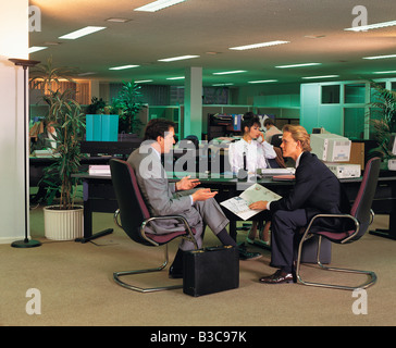 Businessmen discussing in office Stock Photo