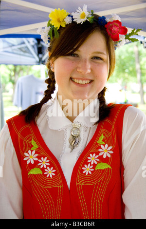 Happy teen wearing garland and costume of Sweden. Svenskarnas Dag Swedish Heritage Day Minnehaha Park Minneapolis Minnesota USA Stock Photo