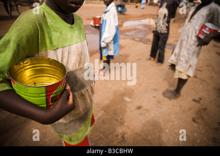 Young students from a koranic school beg on the streets of Koungheul, Senegal Stock Photo