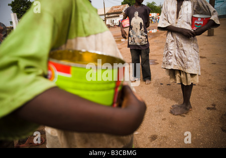 Young students from a koranic school beg on the streets of Koungheul, Senegal Stock Photo