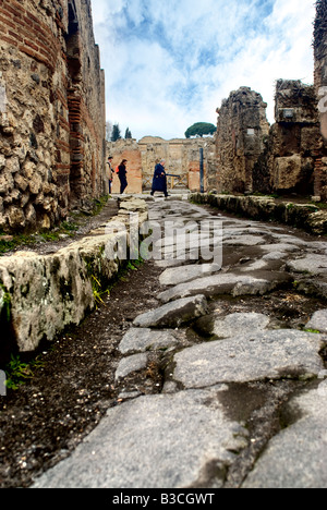 Ancient Paved Road With Carriage Wheel Ruts. Pompeii Italy Stock Photo ...