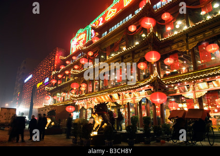 China, Beijing. Chinese New Year Spring Festival - lantern decorations on a restaurant front. Stock Photo