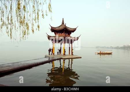 China, Zhejiang Province, Hangzhou. A pavillion early in the morning on West Lake Stock Photo