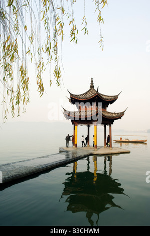 China, Zhejiang Province, Hangzhou. A pavillion early in the morning on West Lake. Stock Photo