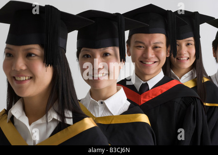 Young graduate students smiling together Stock Photo