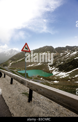 Austria, Tyrol, Kaunertal, Double Bend Road Sign near Weißensee Stock Photo