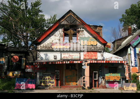 Burnt out house in Detroit Michigan covered in hand painted taxi signs Stock Photo