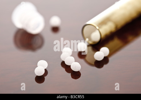 Homeopathic globules in glass tube Stock Photo