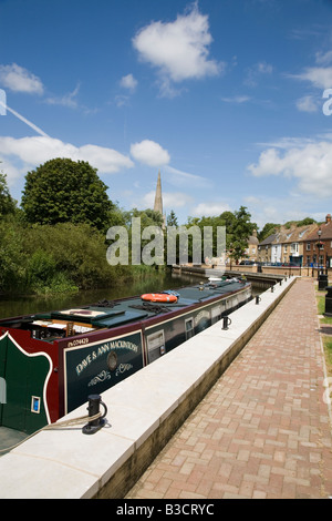 Marina quay and canal boat at St Ives Huntingdonshire looking towards All Saints church Stock Photo