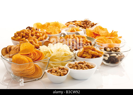 Assorted snacks in glass bowls Stock Photo