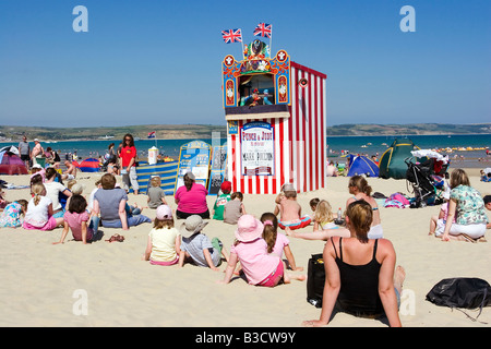 Traditional seaside Punch and Judy show on Weymouth Beach in summer 2008 Stock Photo