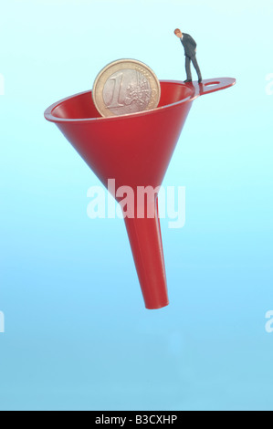 Business man figurine standing on funnel Stock Photo