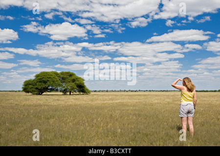 Africa, Botswana, Tourist looking at the landscape Stock Photo