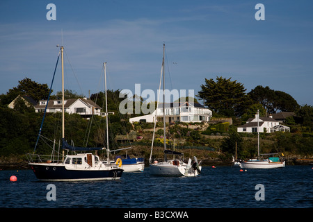 Yachts in the Carrick Roads estuary near Mylor Harbour on the River Fal in Cornwall south west England Stock Photo
